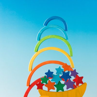 Wooden educational toys for preschool children on a blue background. Montessori method.